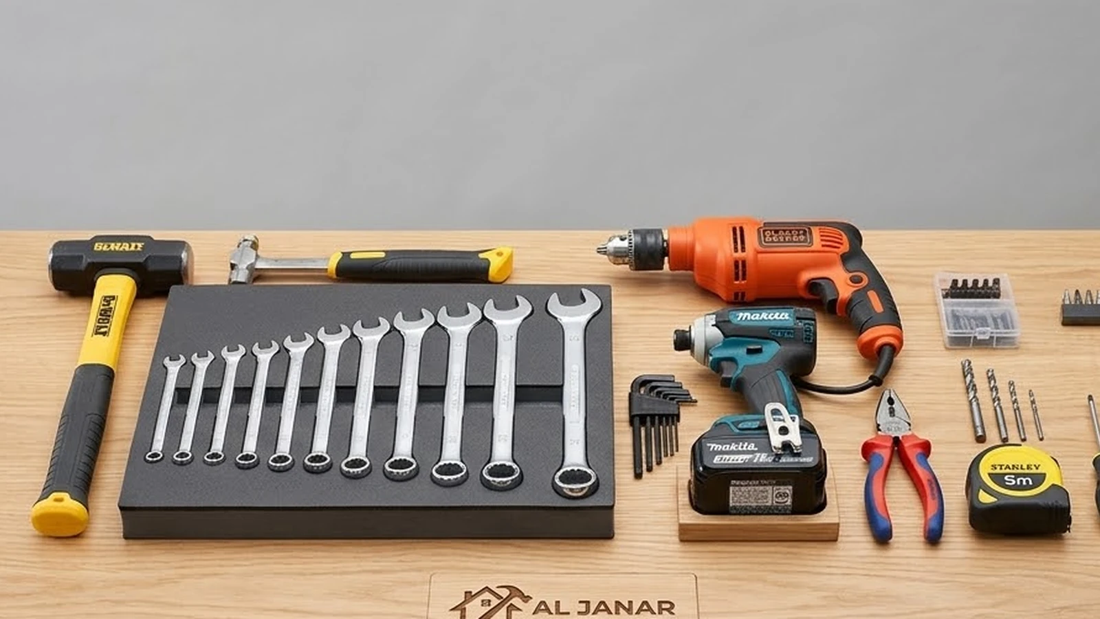 Organised set of hand tools, wrenches and power drills on a workbench